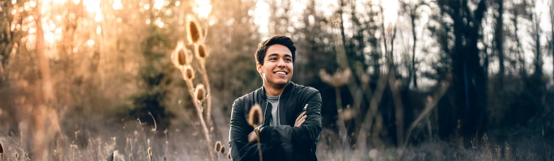 A man smiling outside.